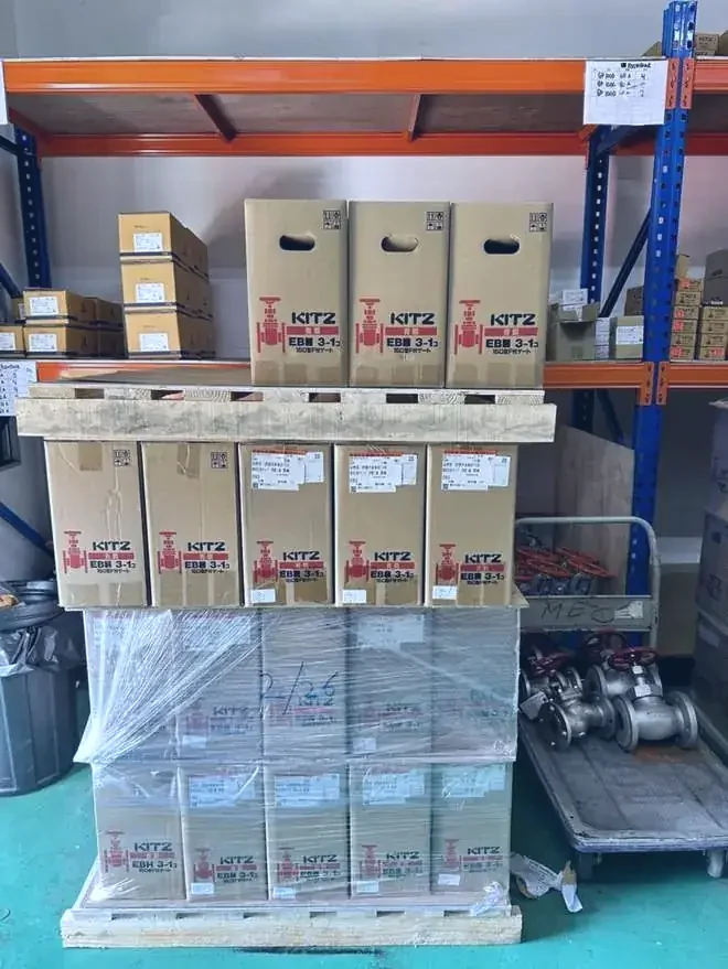 Palletised valve stock in a racking bay, picked and staged for collection